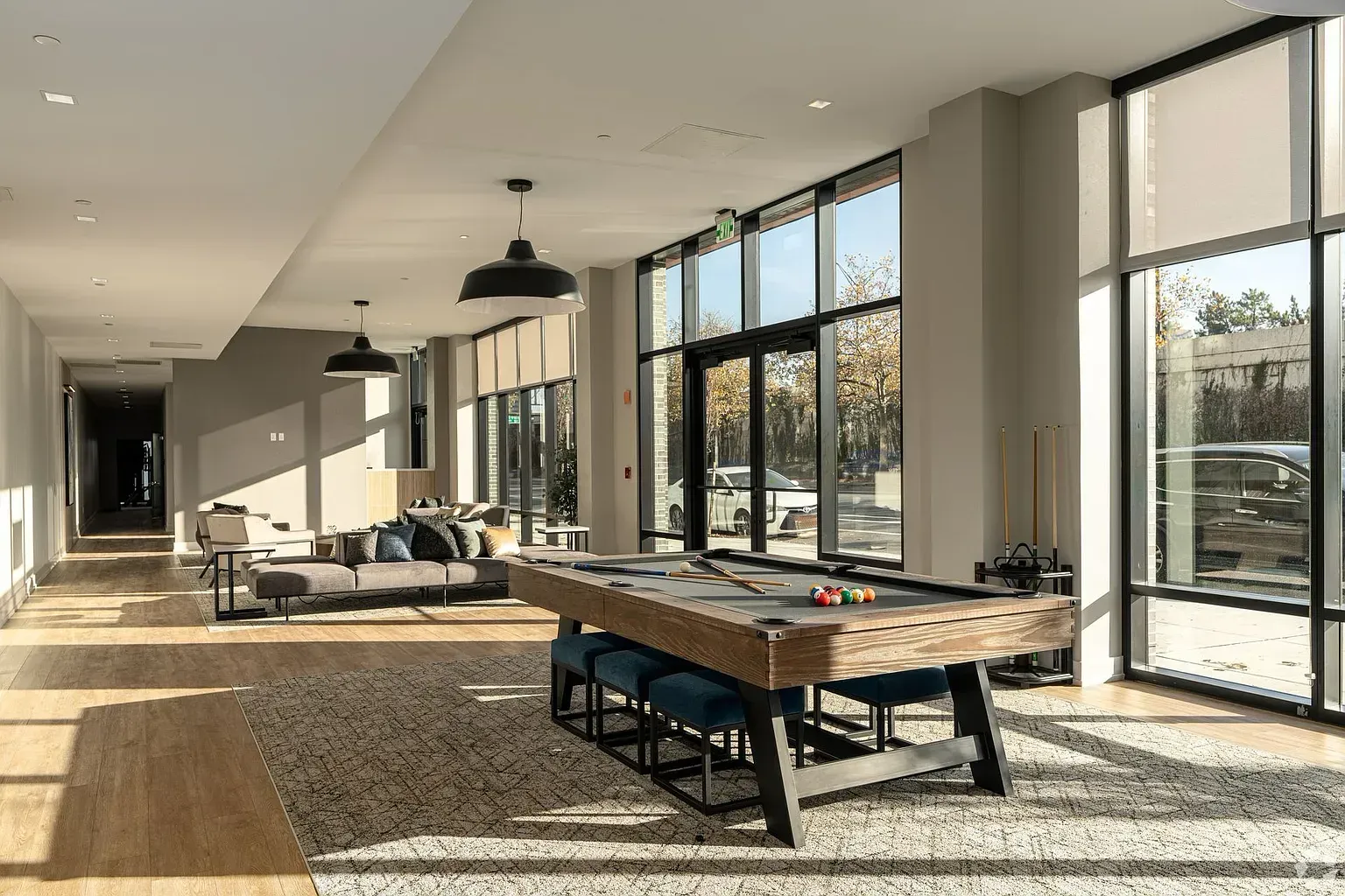 Photo of the community lounge area showing a pool table in the foreground