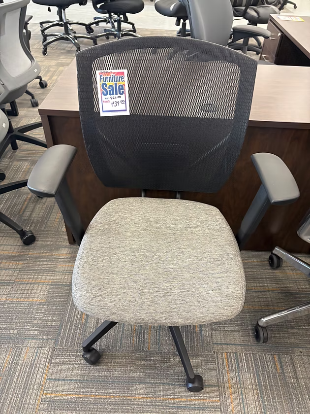 Office chair with black mesh back, gray seat, and gray armrests.