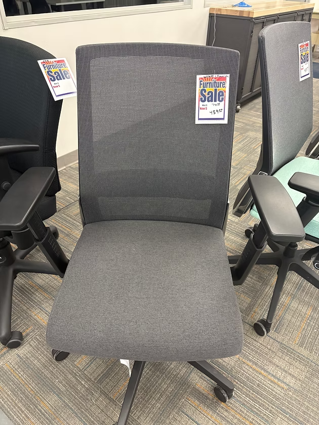 Gray office chair on sale. Mesh back, fabric seat, black arms, rolling base.