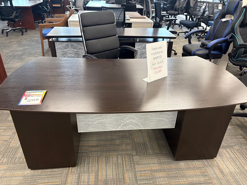 Brown executive desk in a furniture store.