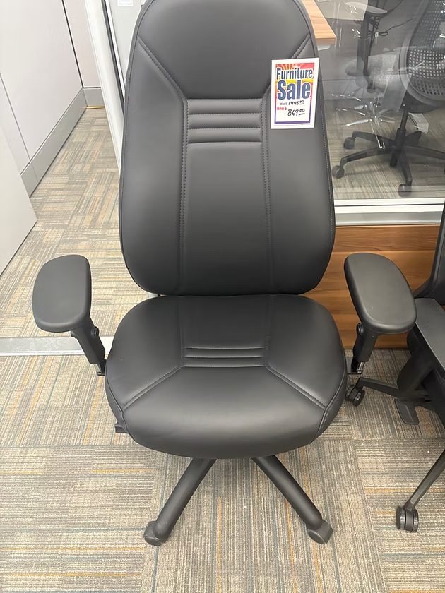 Black office chair on sale. Has armrests, a high back, and a five-star base.