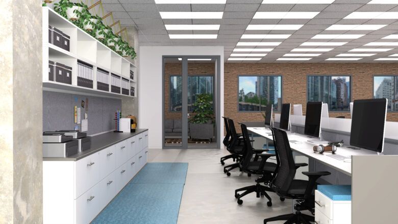Modern office interior with workstations, brick wall, and a service area with storage and plants.