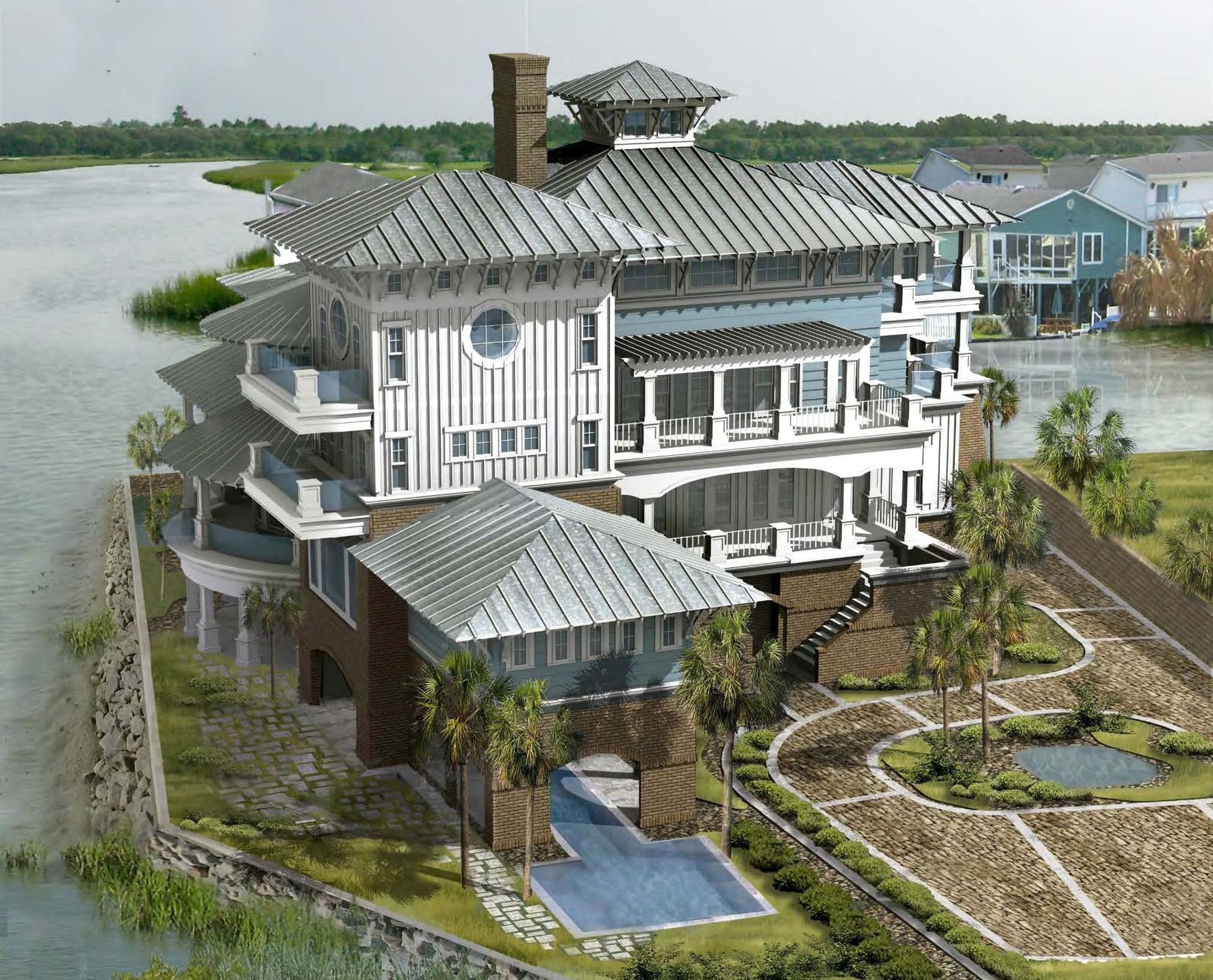 an aerial view of a large house surrounded by water