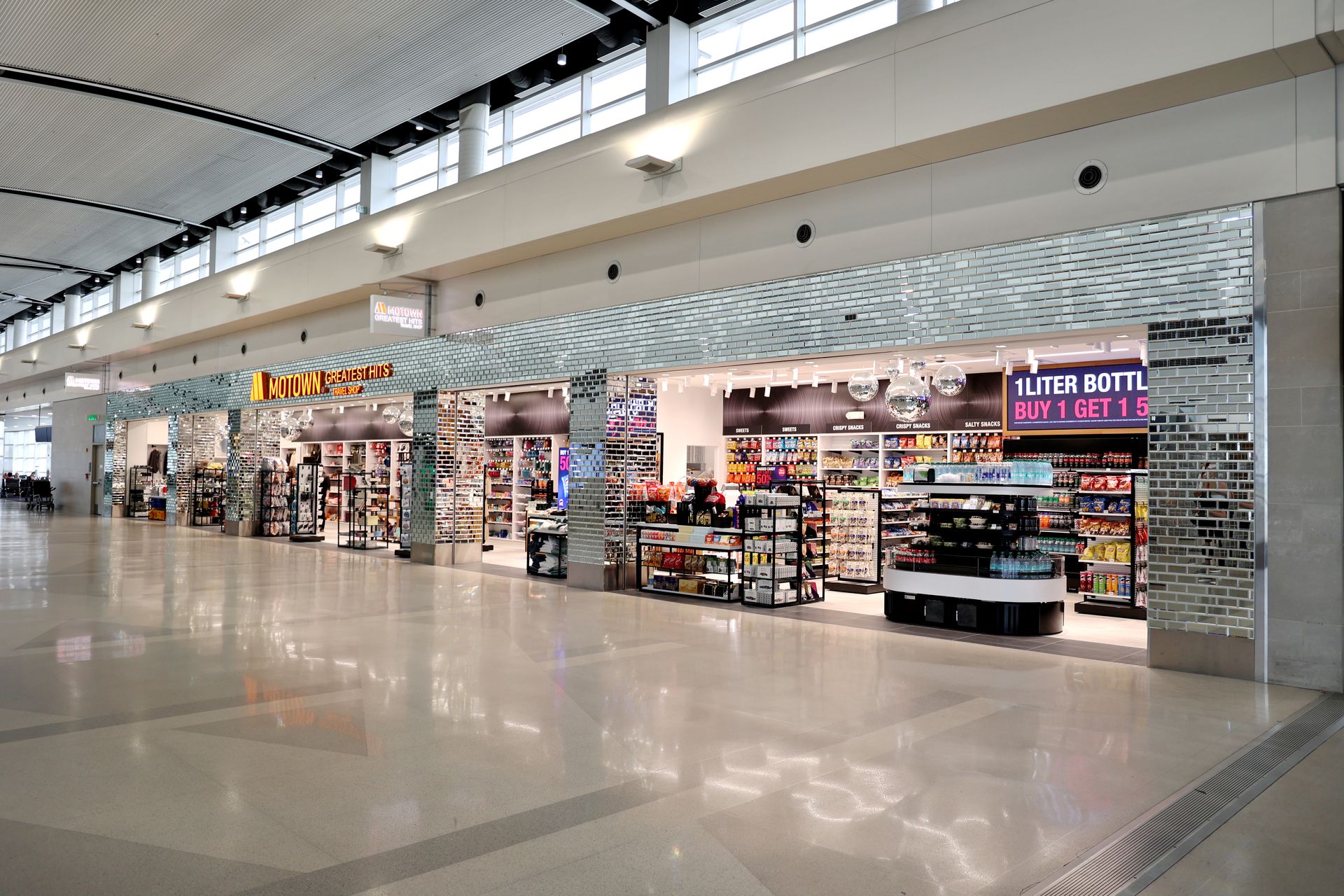 Airport convenience store with snacks, magazines, and travel essentials.