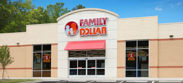 Exterior of a Family Dollar store with red awning and logo against a blue sky.