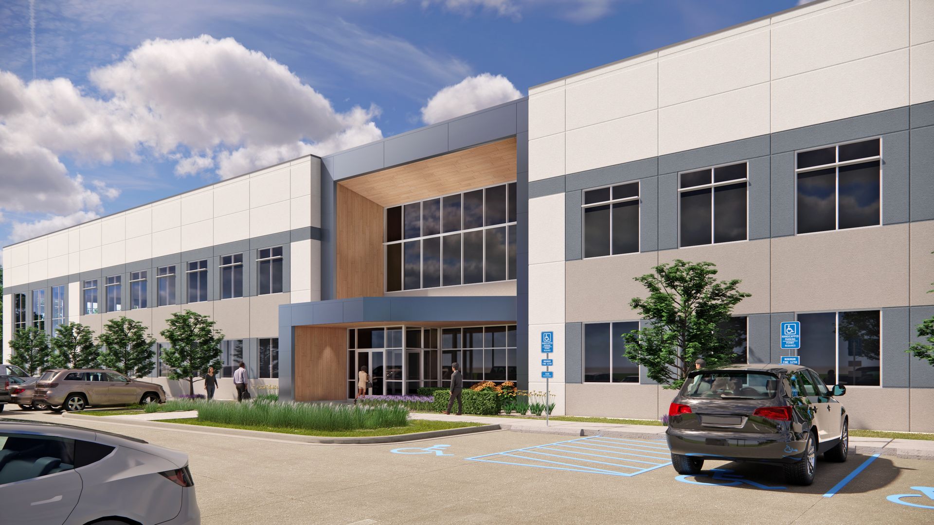 Modern two-story office building with blue and white exterior, front entrance, and accessible parking.