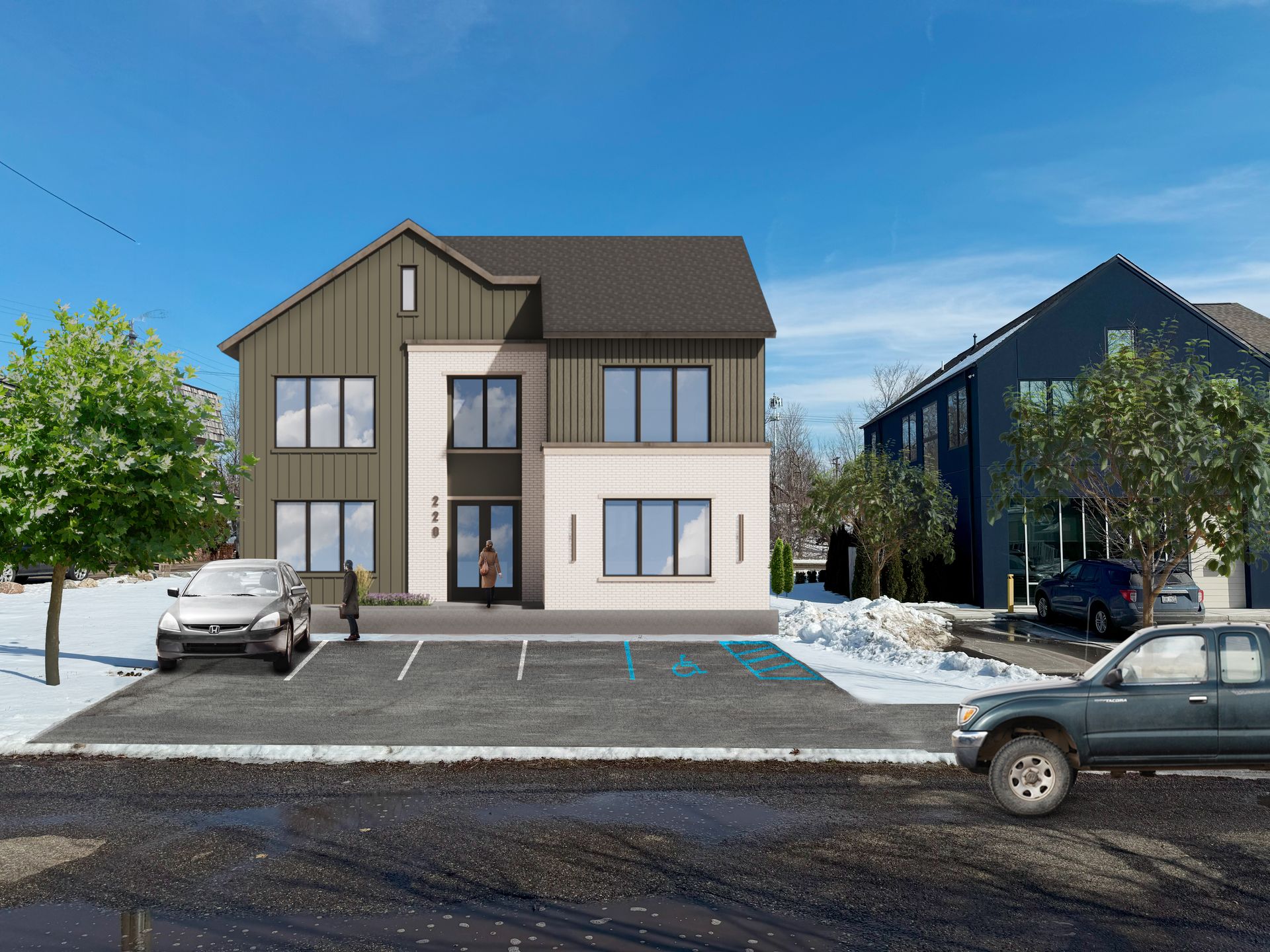 Modern two-story building with parking spaces and a person in front. Snowy environment.