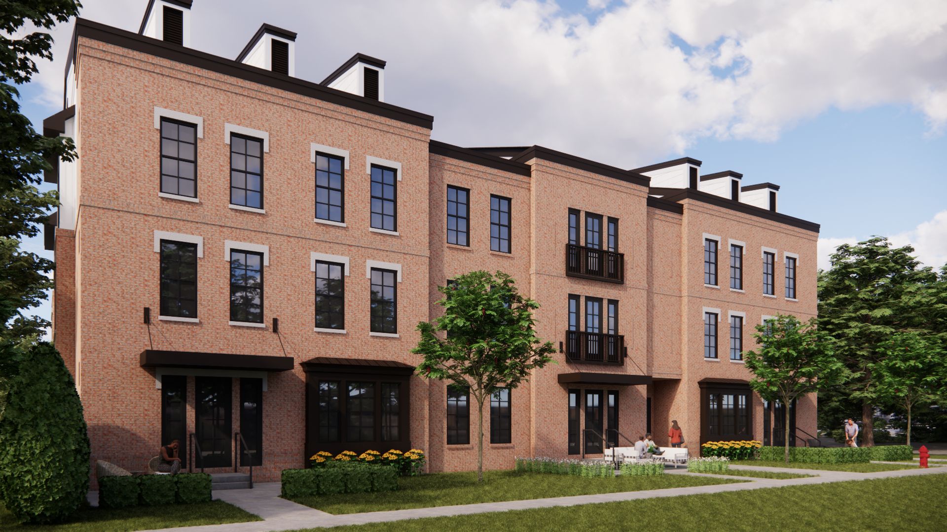 Row of brick townhouses with dark windows and small balconies, sunny day.