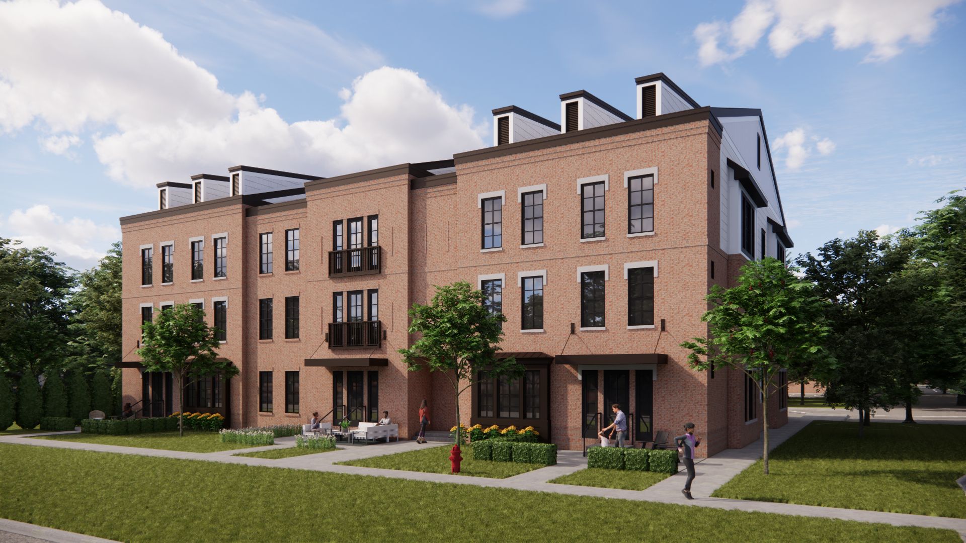 Brick townhouses with black accents, green grass, and trees on a sunny day.
