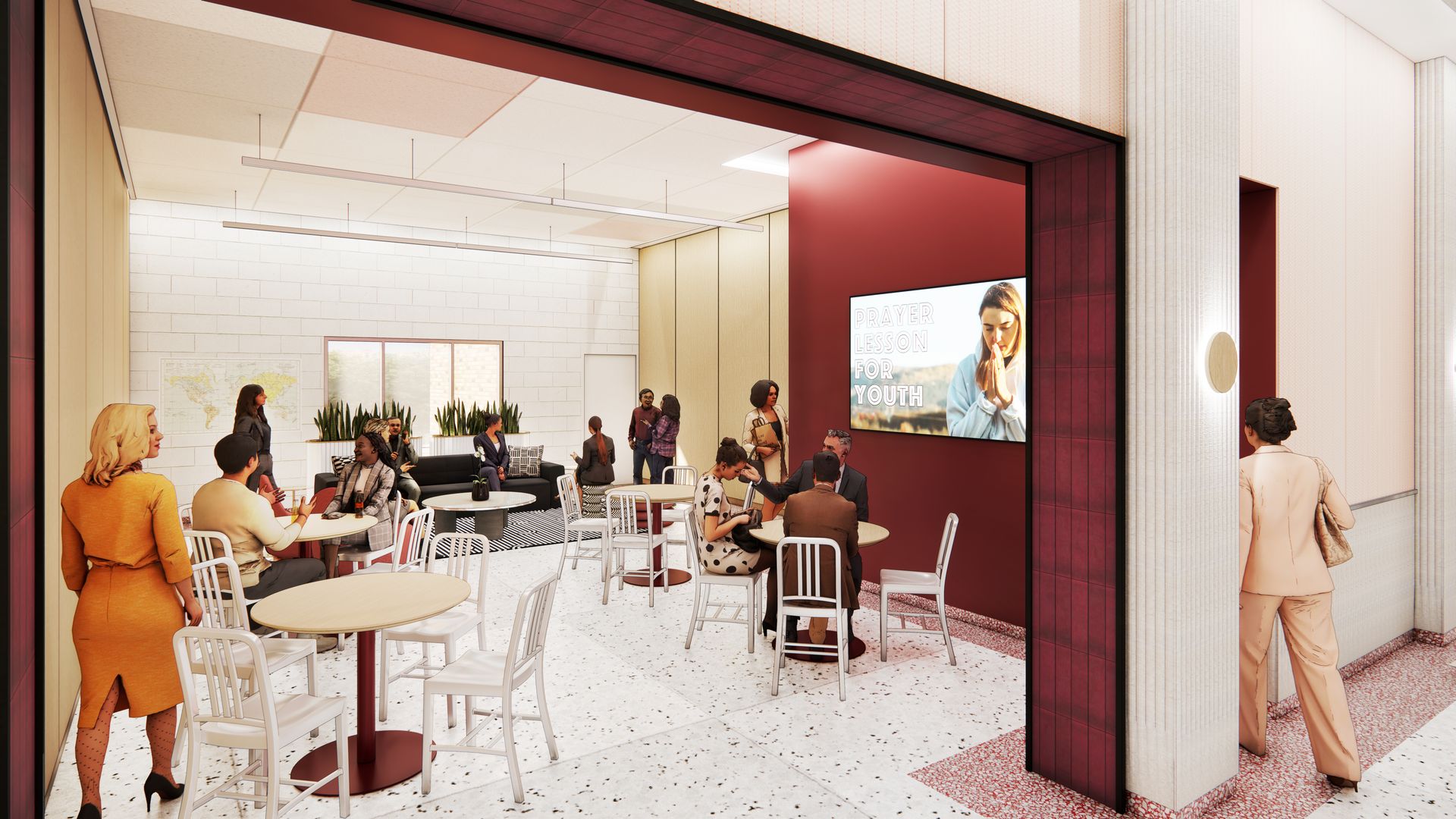 People gather in a brightly lit lounge. Tables and chairs are scattered around, with a TV screen and plants visible.