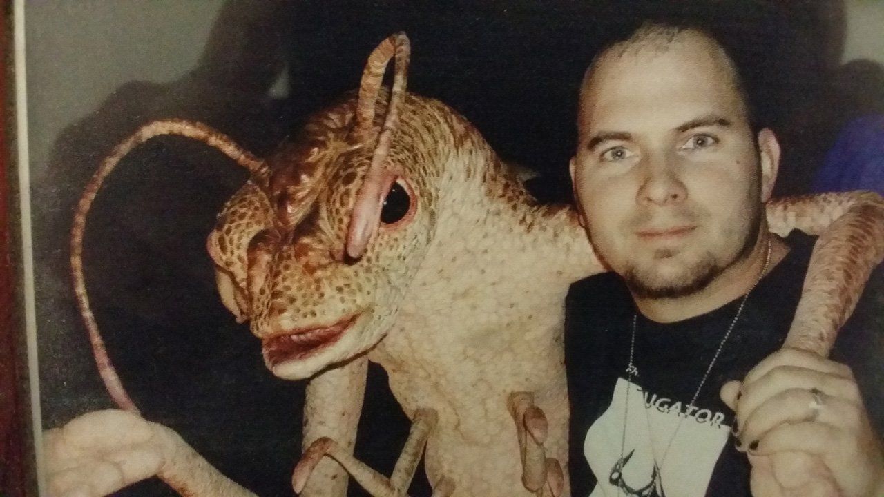 Valek X. Sykes With a Life Size Alien Prop