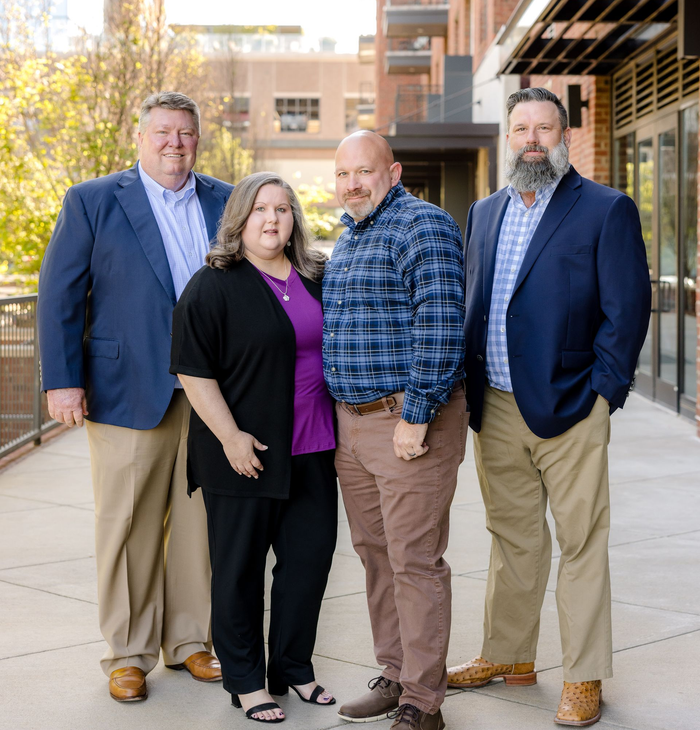 SRS Properties Group real estate team in business attire 