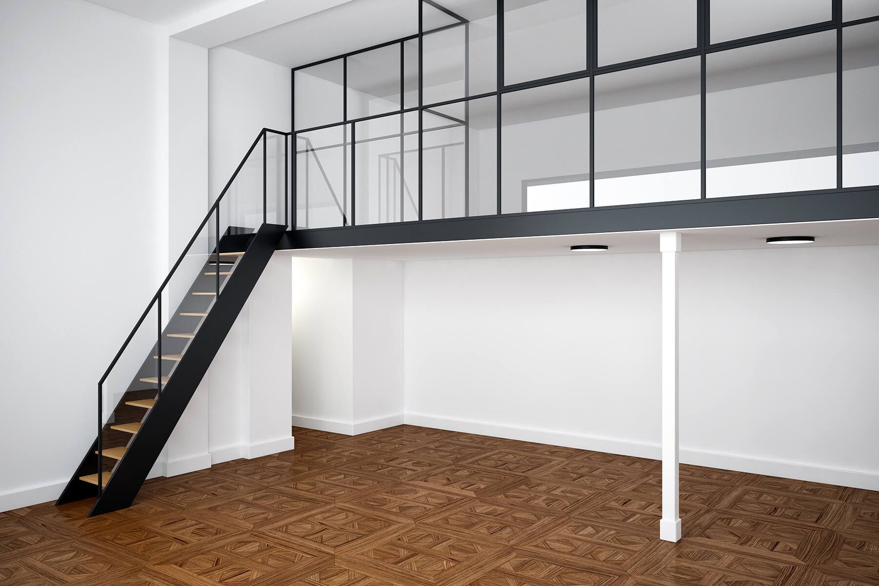 an empty room with a staircase leading up to the second floor .