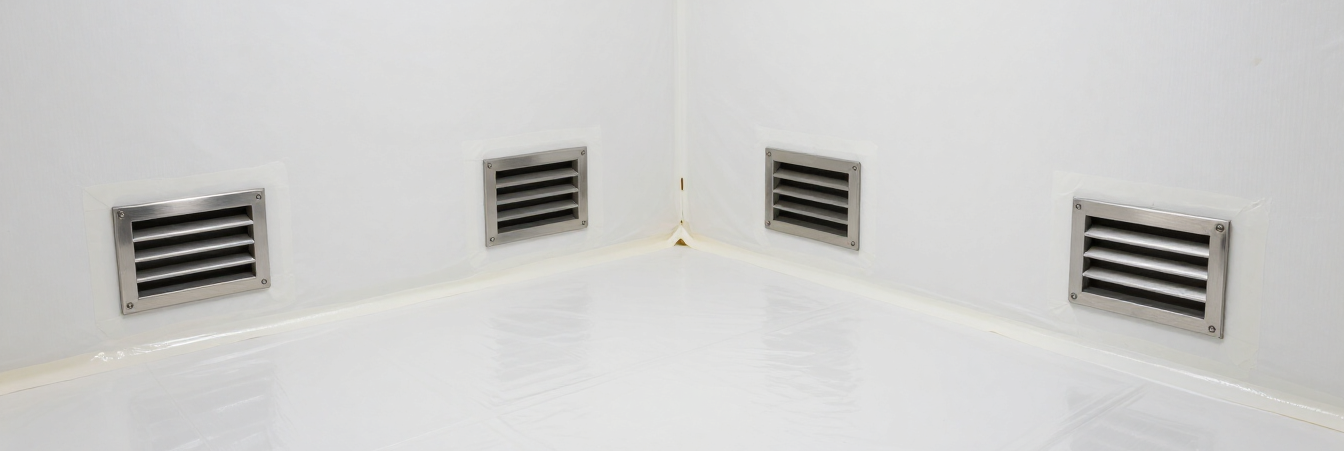 Sealed crawl space with white vapor barrier on walls and floor