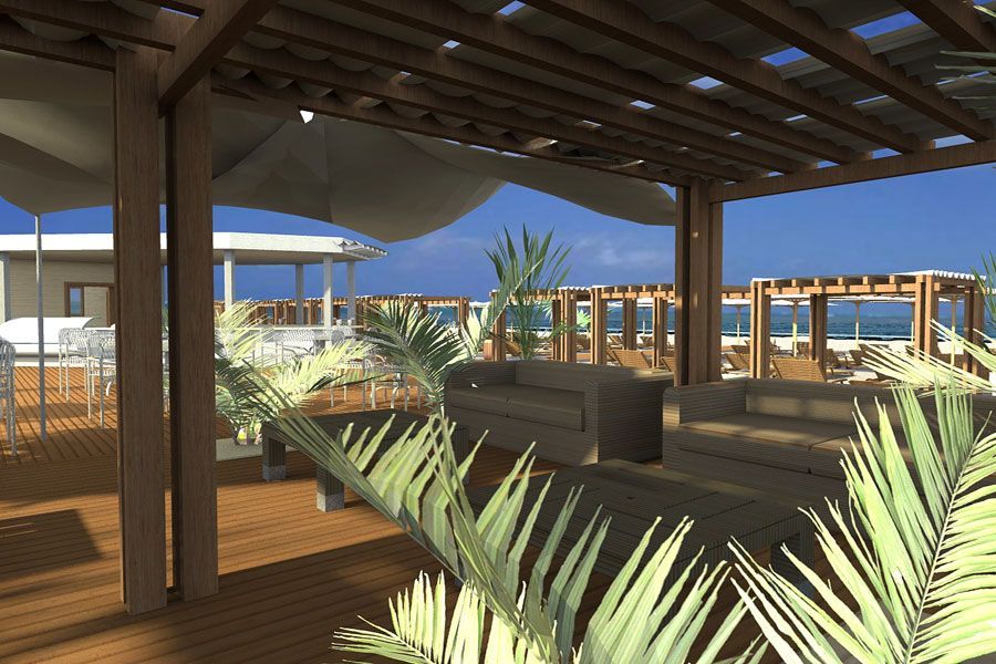 Terrazza in legno soleggiata con pergola, divani e piante tropicali con vista sull'oceano.