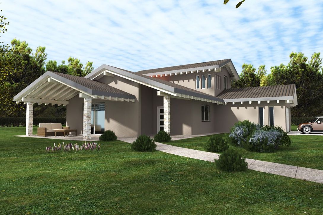 Casa moderna con veranda coperta, ampie finestre e prato verde sotto un cielo parzialmente nuvoloso.