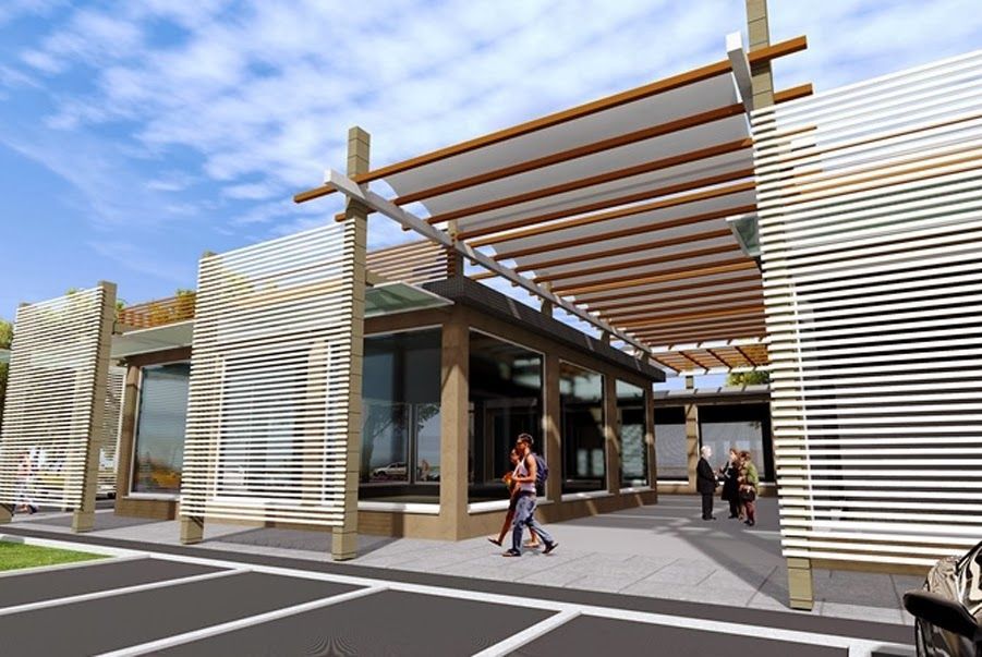 Ingresso di un edificio moderno con listelli di legno, pareti di vetro e persone che camminano all'esterno.
