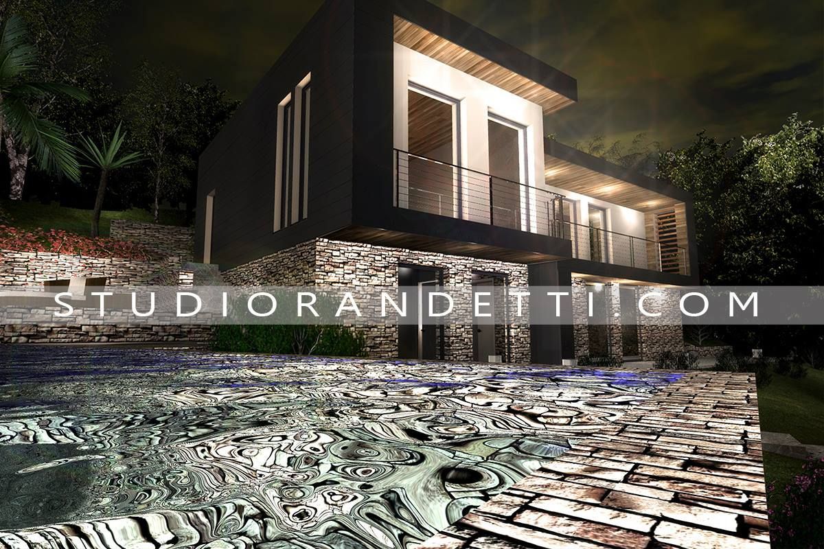 Casa moderna con finestre illuminate e balcone di notte, adiacente a un vialetto in pietra e a una piscina, con filigrana STUDIORANDIETTI.COM
