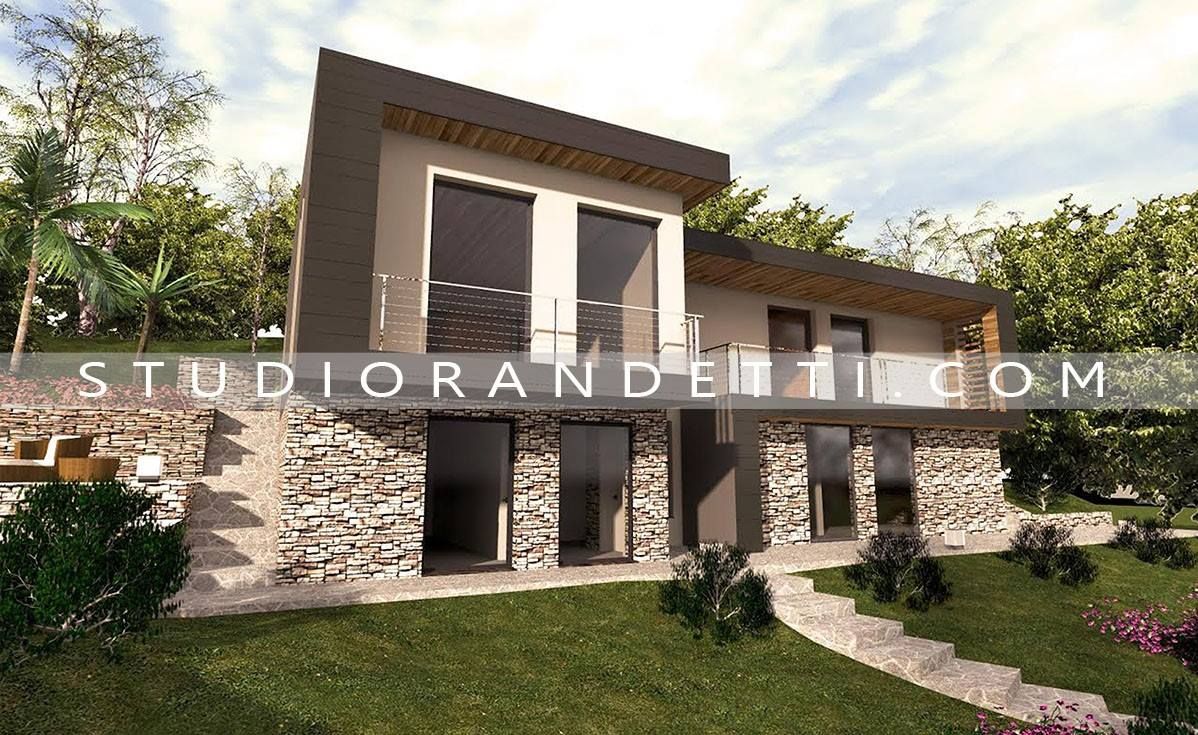 Esterno di una moderna casa a due piani con dettagli in pietra, ampie finestre e un giardino anteriore ben curato.