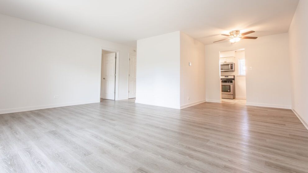 photo showing a large living room with plenty of natural light