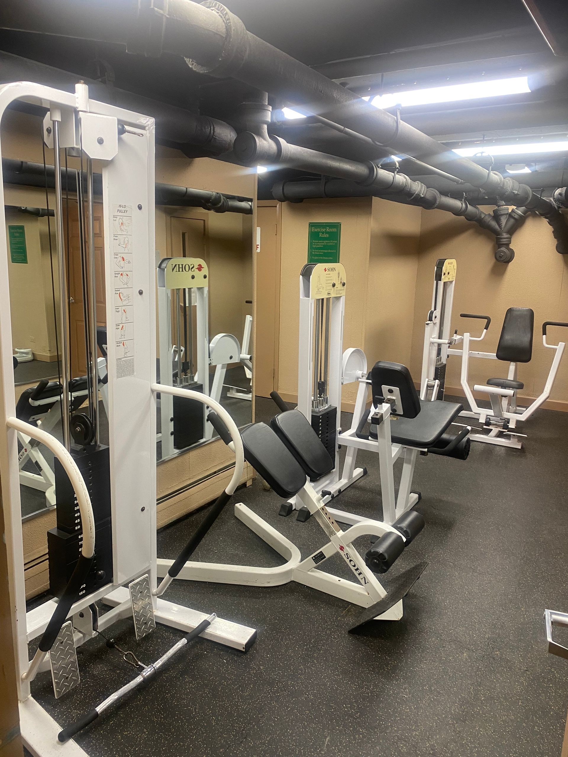 photo of fitness center with various equipment