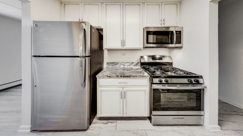 photo showing appliance area and cabinets