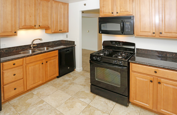 Photo of a kitchen with dark counter colors