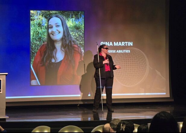 Gina presenting a keynote speech