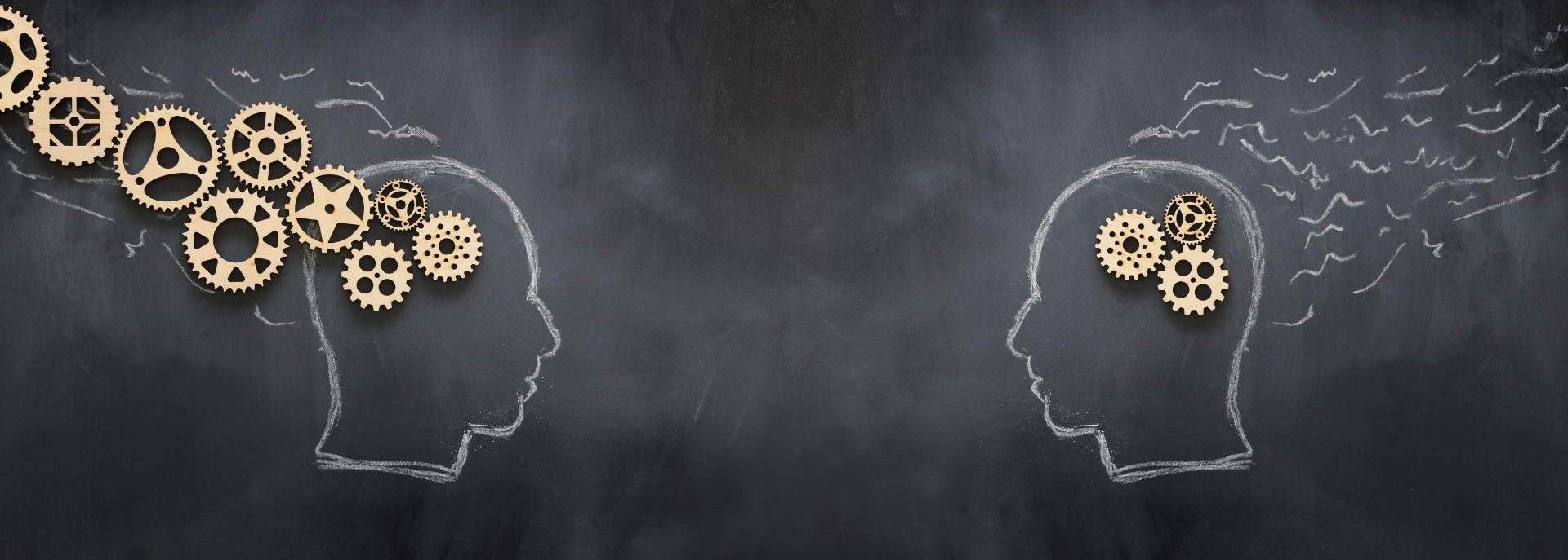 1 head on the left and 1 head on the right, facing each other, and each with cog wheels to symbolize the brain