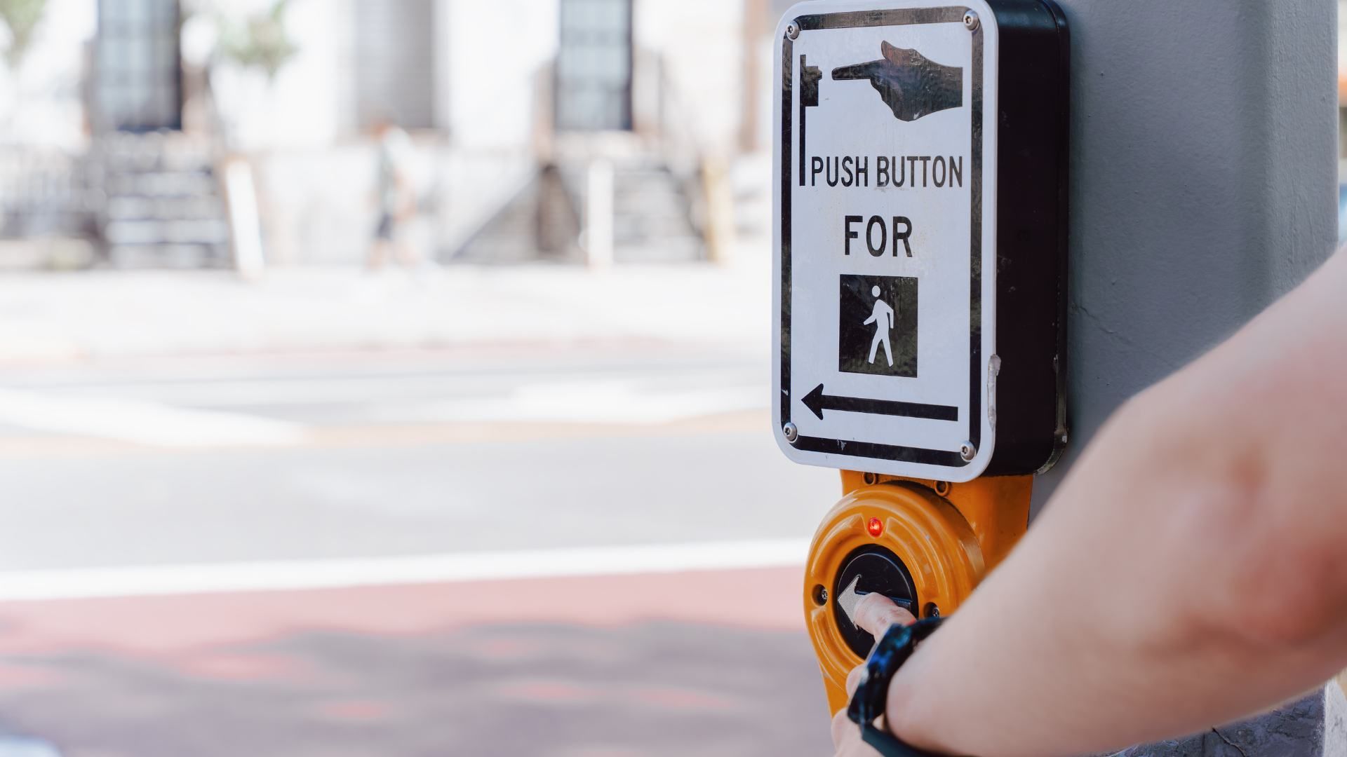 Person pushing the crosswalk button