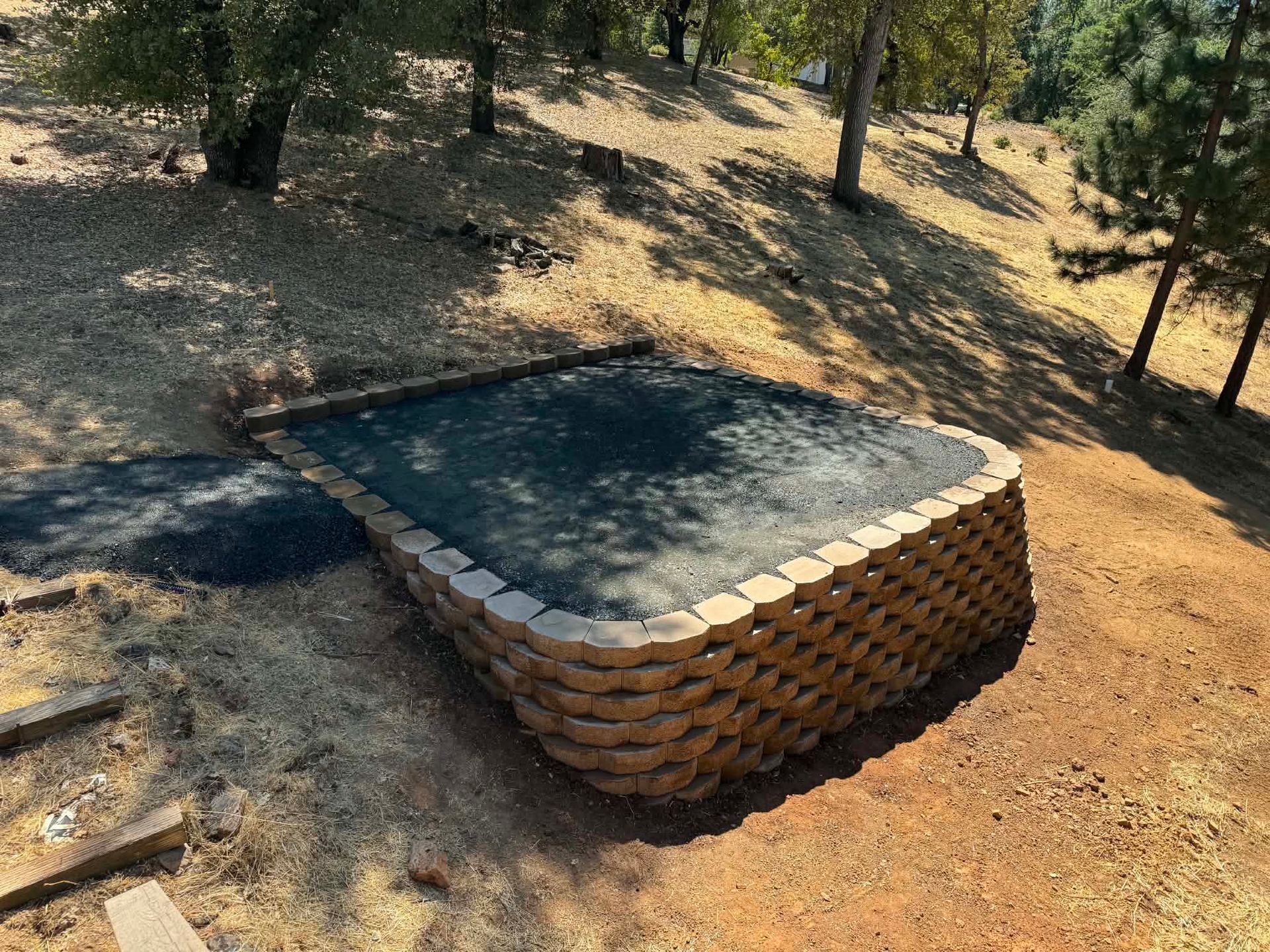 Hillside Reataining Wall we built for a new structure to sit on.