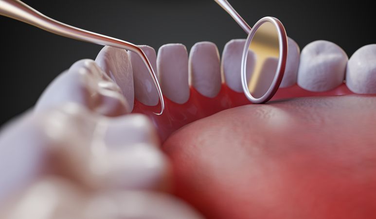 Dental hygienist high-fives a child while a parent smiles in a bright clinic room