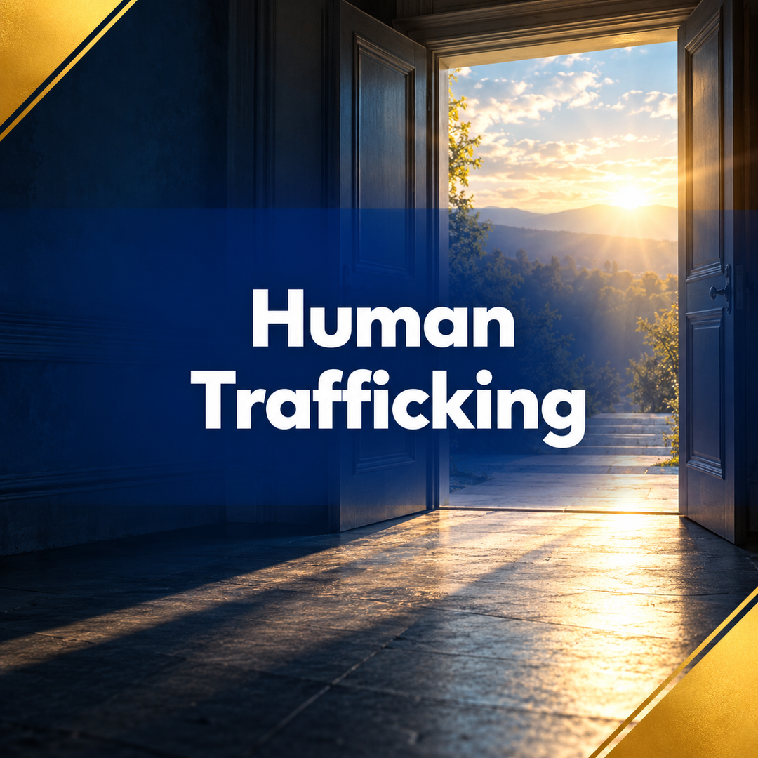 Human trafficking text over a sunlit doorway with blue shadow and gold accents