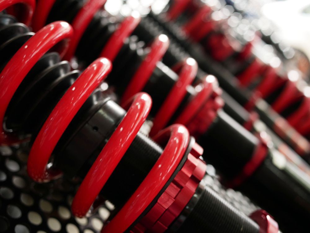 A Close up Of a Red and Black Shock Absorber — Wilkomotive Mechanical in Bentley Park, QLD