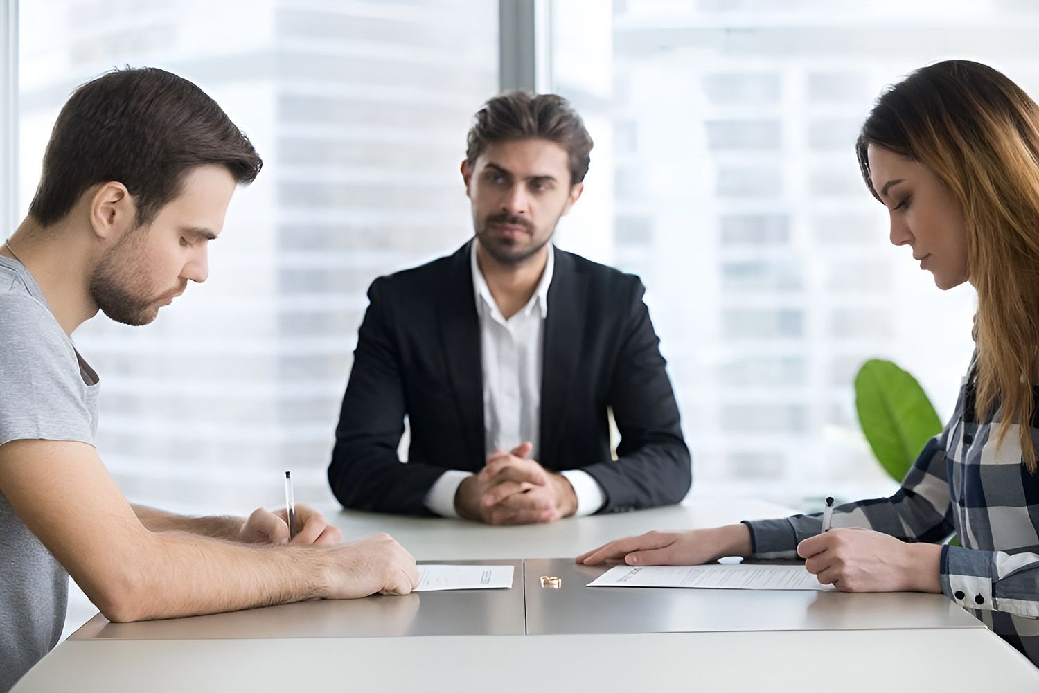 Couple Discussing Property Settlement With A Mediator