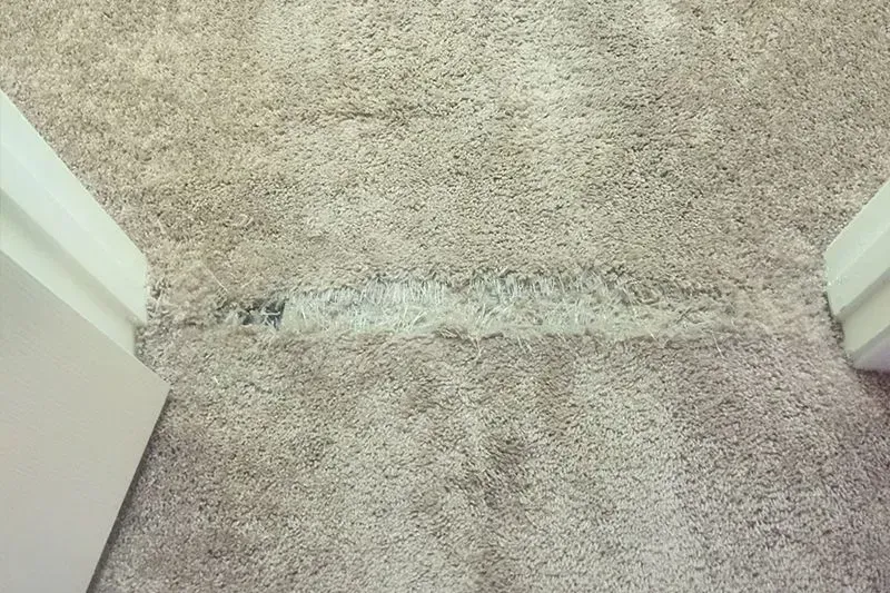 Before carpet repair service.