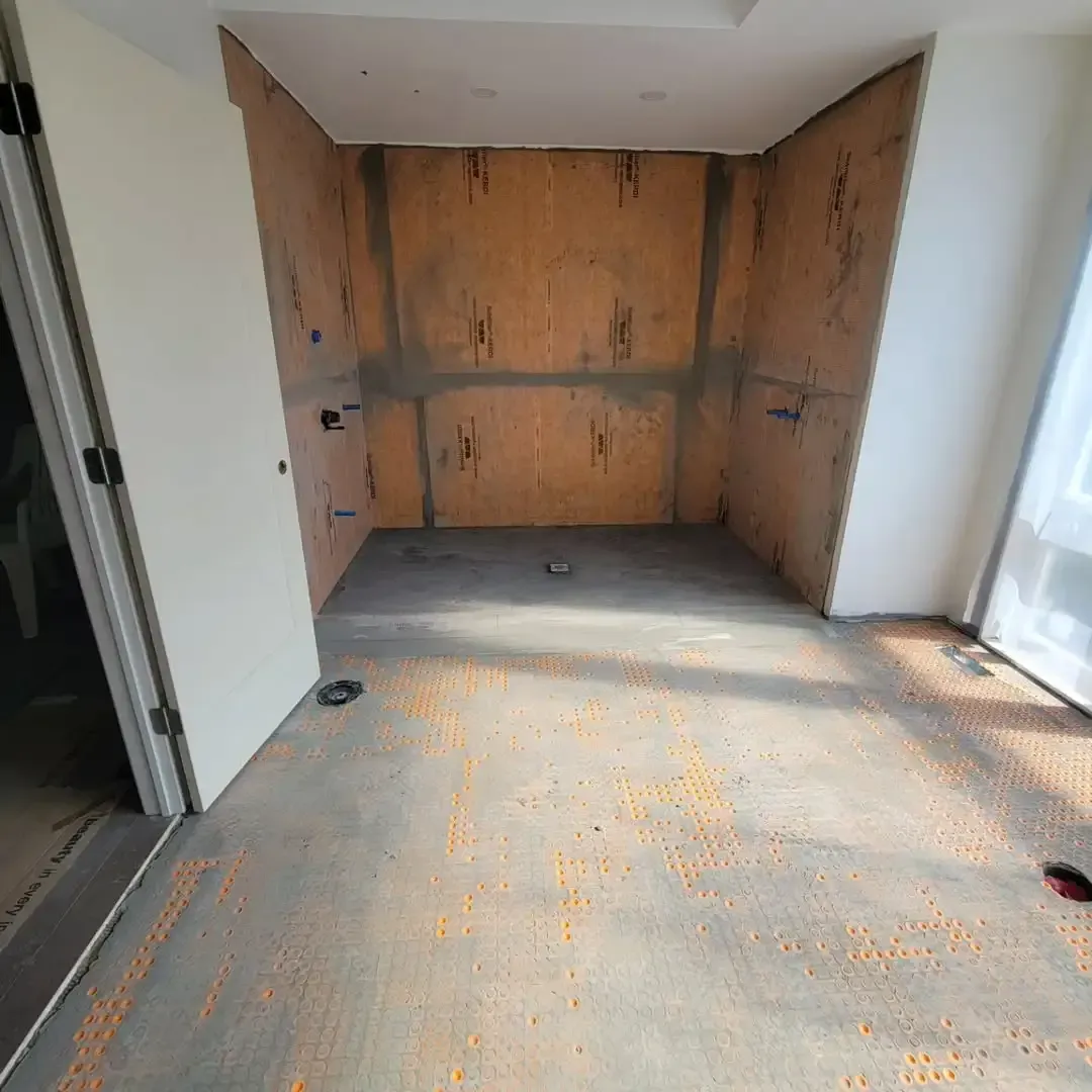 Before ceramic tile flooring installation service in Denver home bathroom.