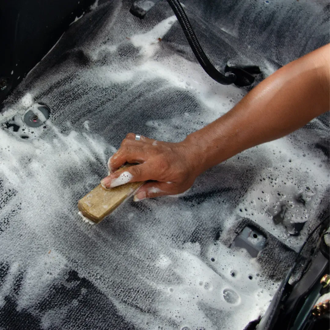 Blas Carpet professional scrubbing stains on car carpet using the upholstery shampooing method in Columbus, Ohio
