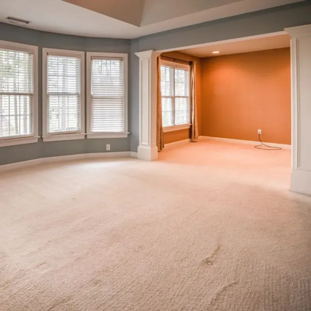Worn out and damaged carpet being repaired instead of fully replaced in Denver, Colorado home.