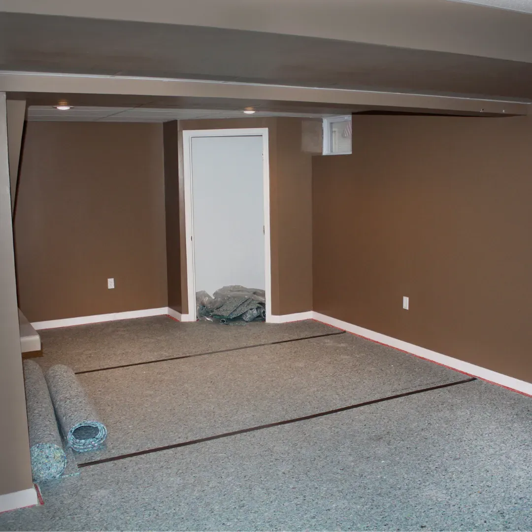 Blas Carpet specialist laying new carpet padding down in Atlanta, Georgia home.