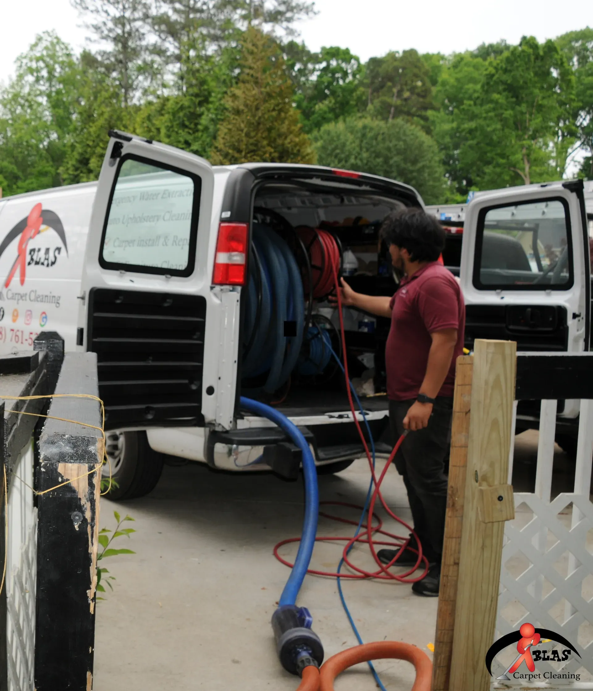 Professional carpet cleaning specialist removing stains from carpeting in Denver Colorado home.