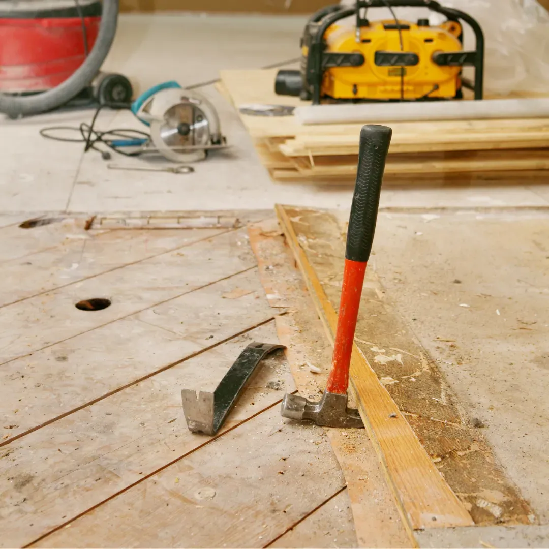 Removing old hardwood floor and replacing it with vinyl plank flooring.