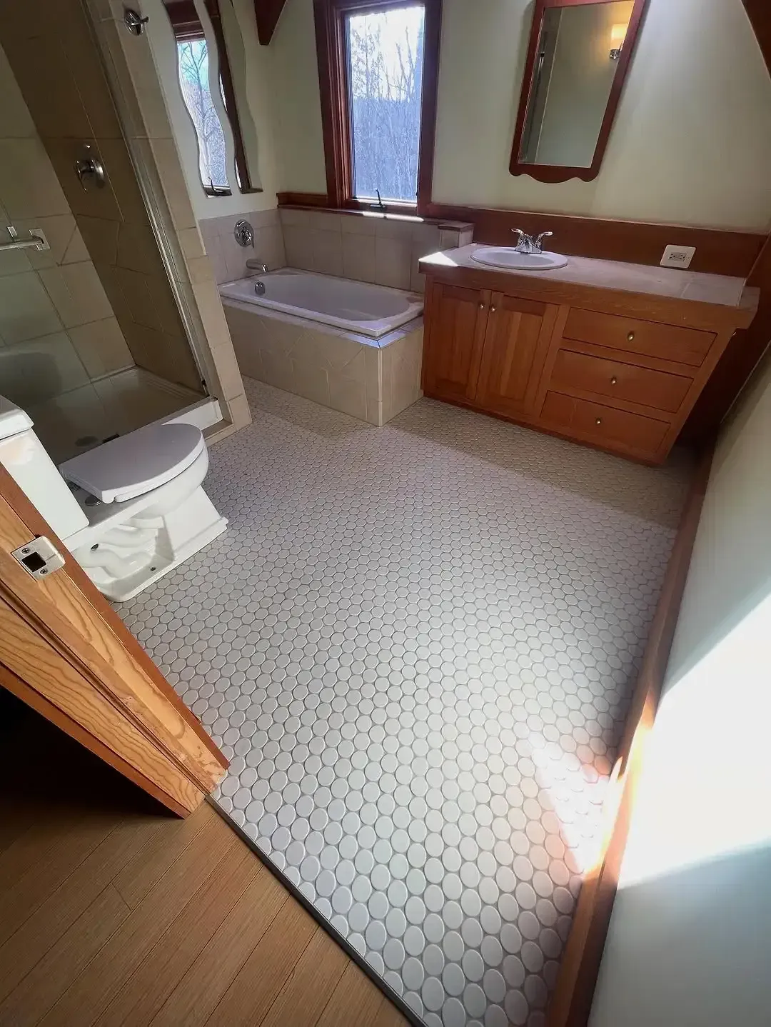 Professionally installed mosaic ceramic tile flooring installation service.
