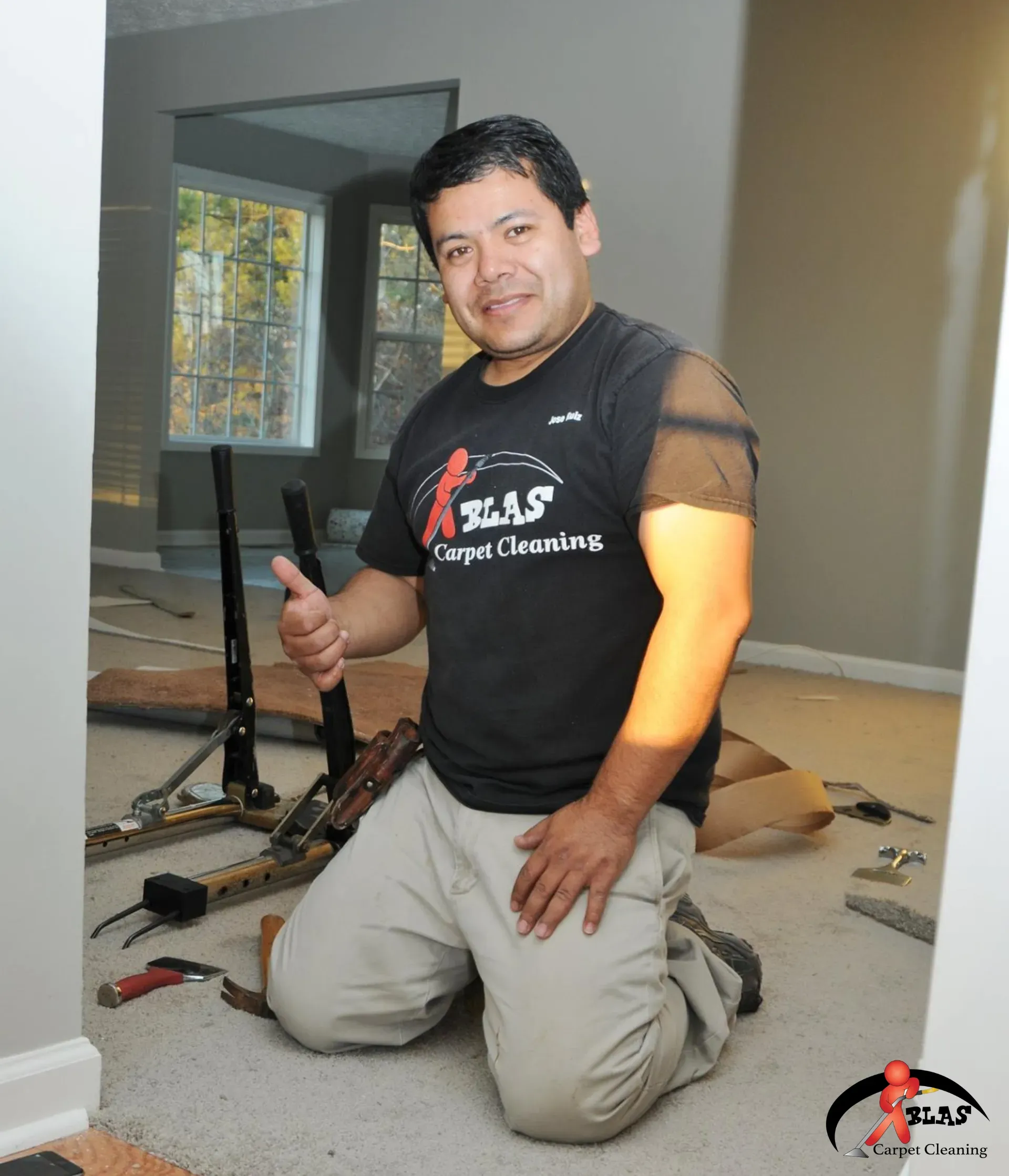 Carpet installation professional preparing to replace home carpet.