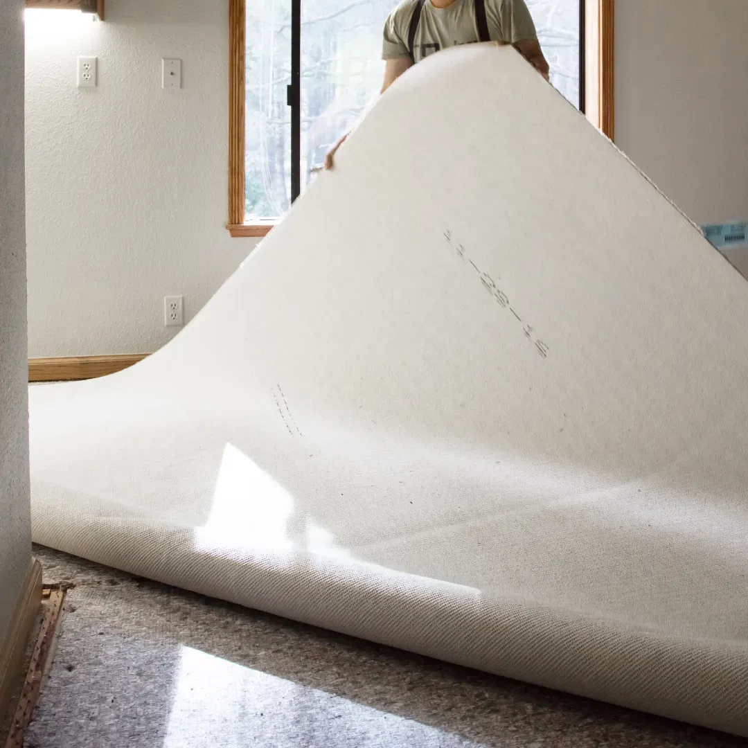 Aged and worn out residential carpet being removed in Atlanta, Georgia home.