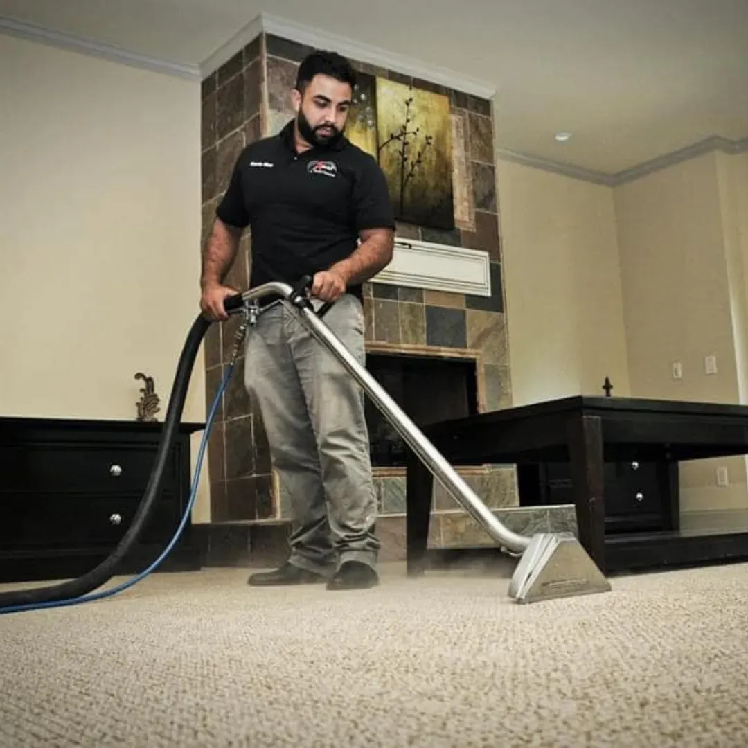 Professional carpet cleaning technician steam cleaning stains in Columbus, Ohio home.
