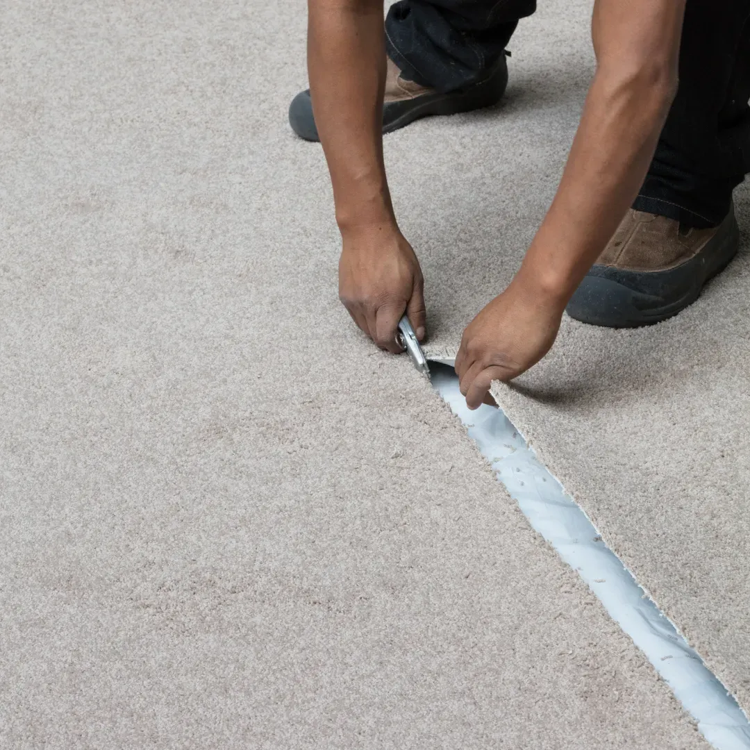 Blas Carpet specialist laying new carpet down in Atlanta, Georgia home.