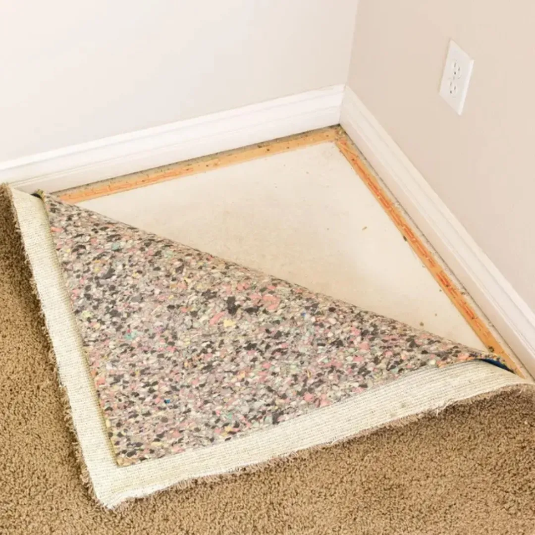 Blas Carpet specialist installing new carpet padding.