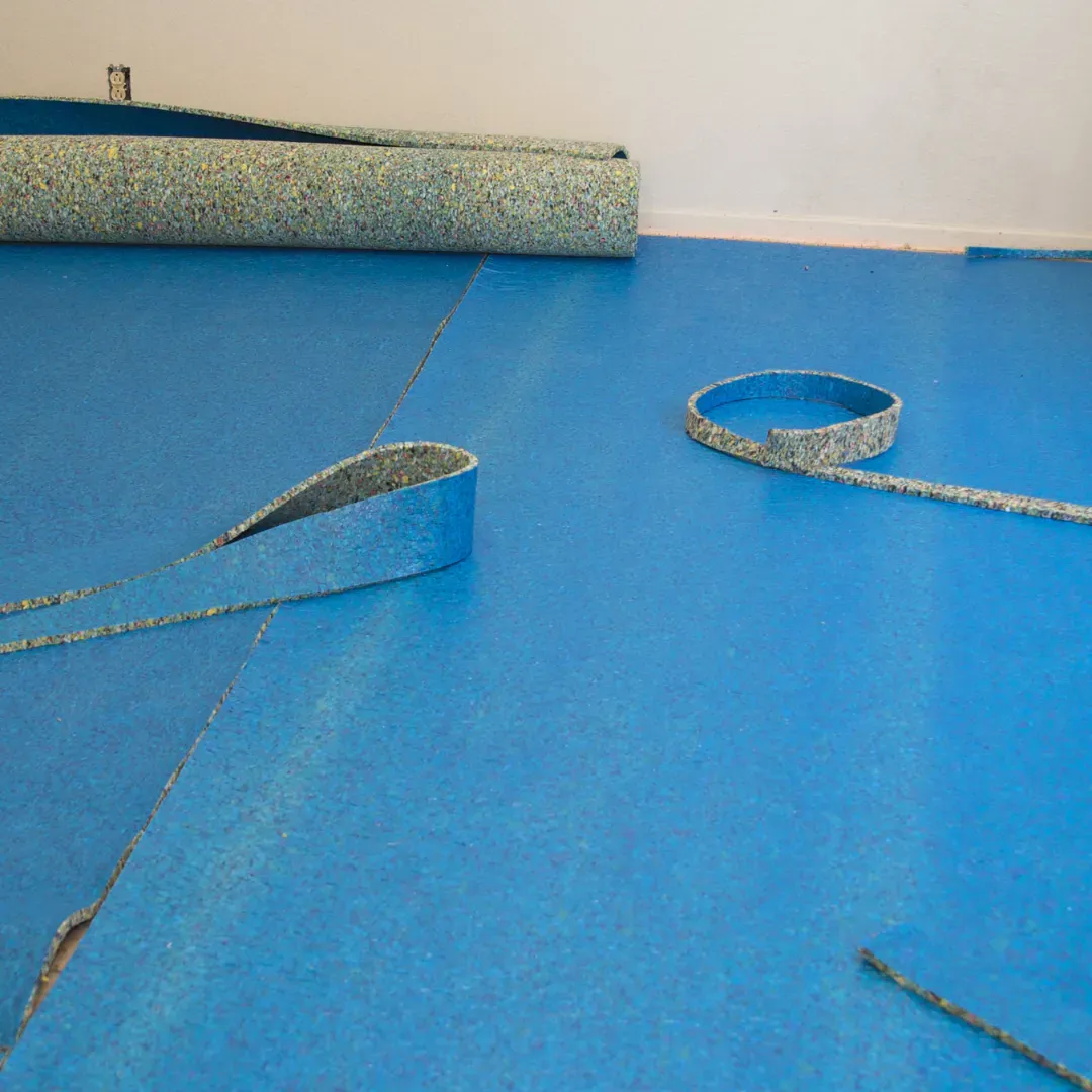 Blas Carpet specialist laying new carpet padding down in Atlanta, Georgia home.