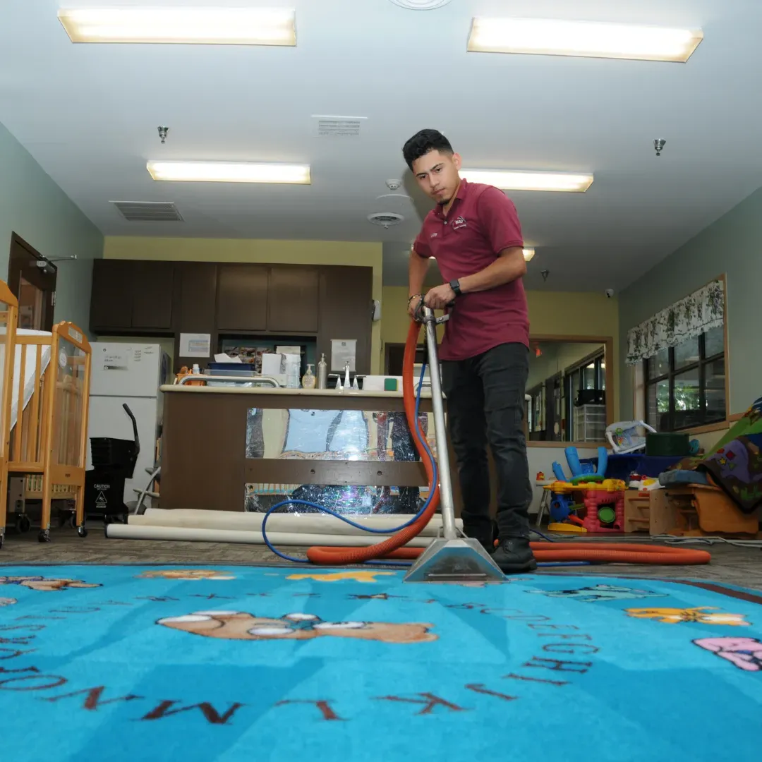 Carpet cleaning specialist removing stains from rug in Denver, Colorado.